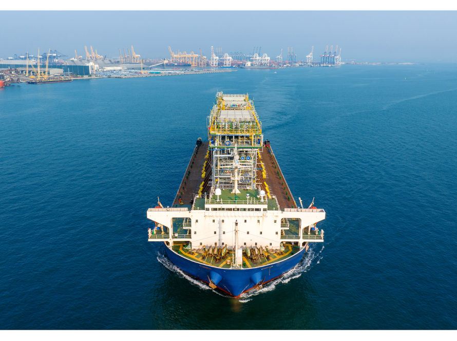 Specialized offshore cable-laying vessel installing high-voltage submarine power lines for Dubai's man-made islands.